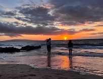 Our girls enjoying the beach at sunset.
