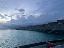 Evening view of cabanas over the water