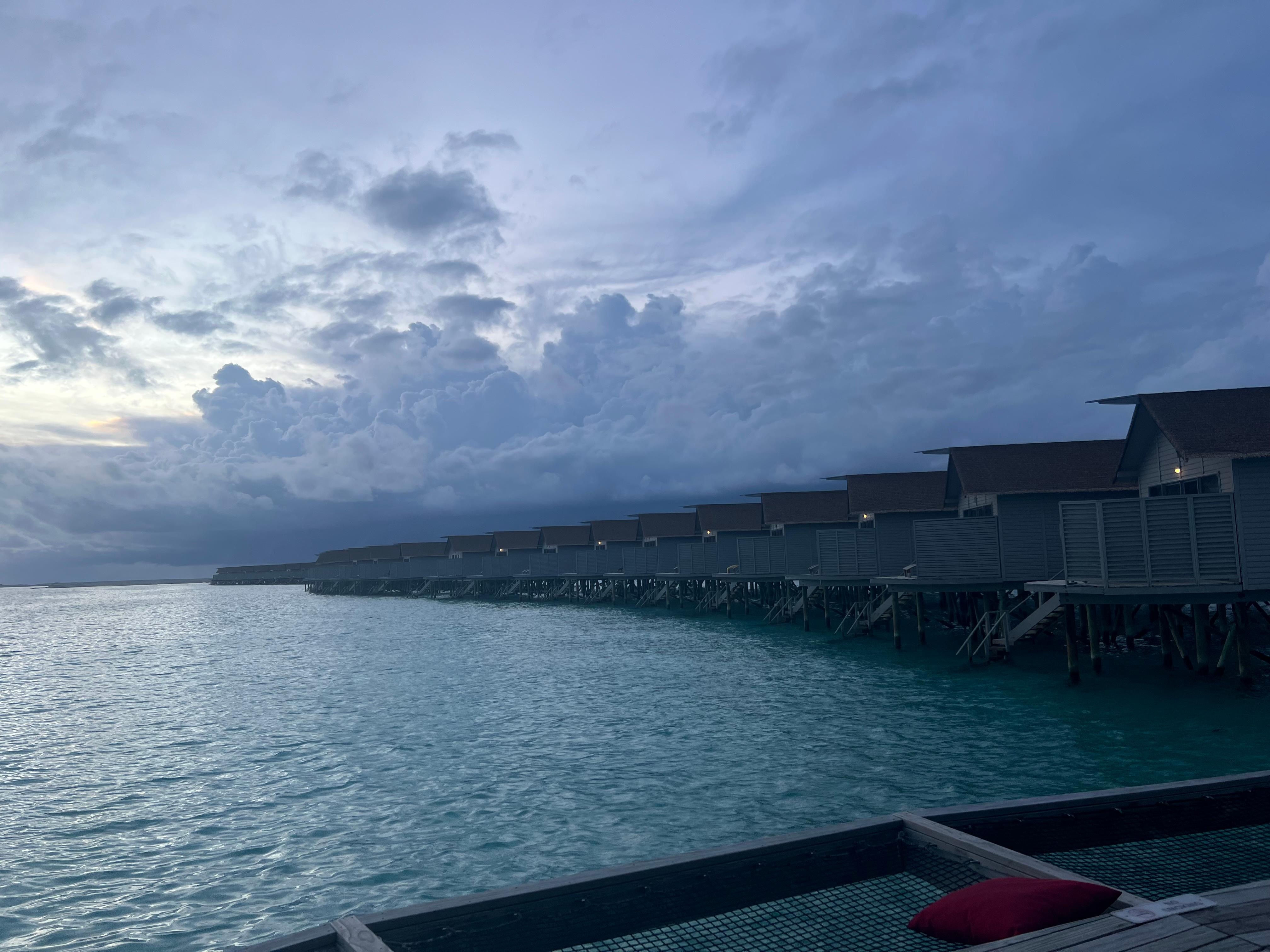 Evening view of cabanas over the water