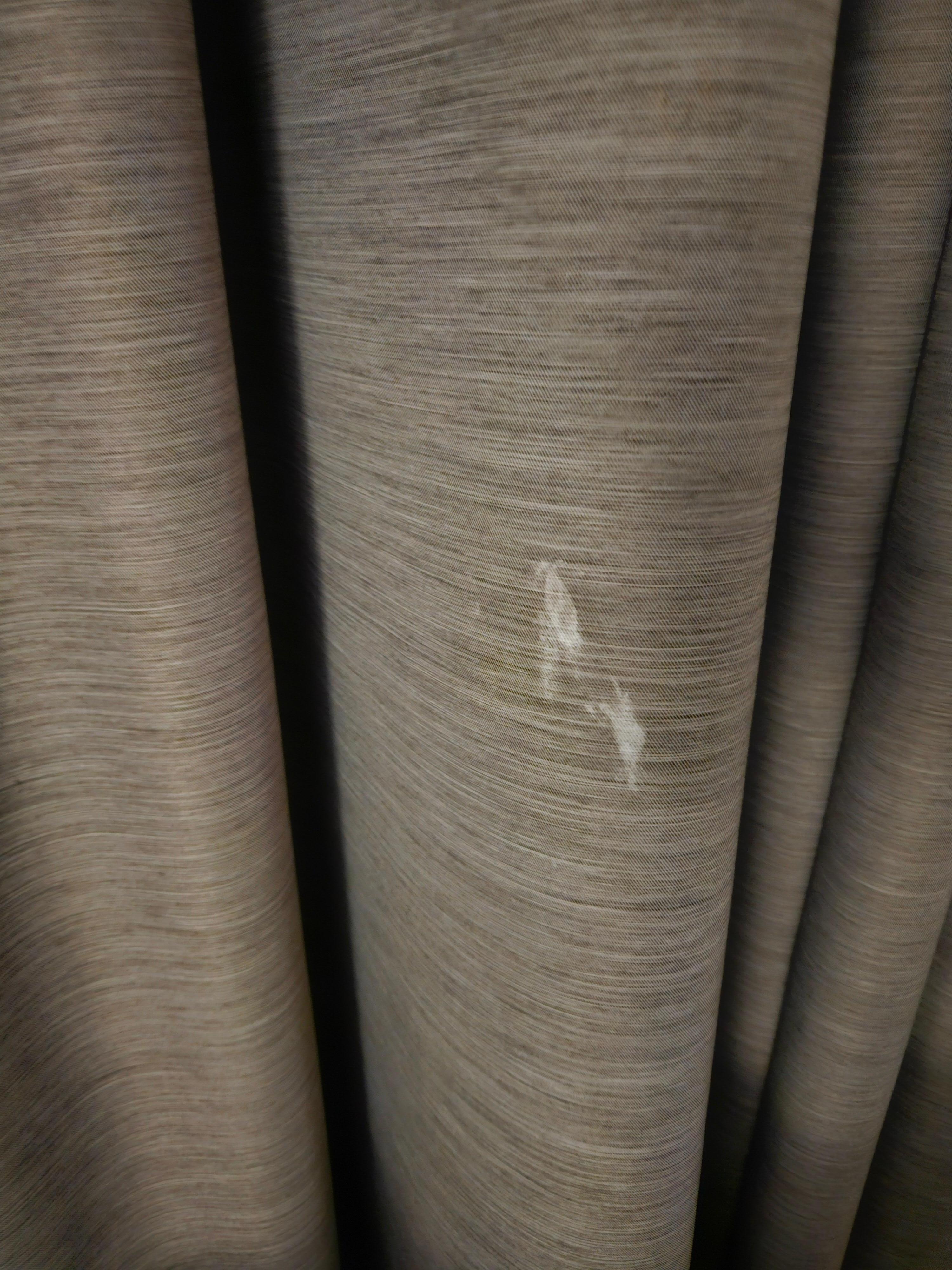 Dirty curtains with who knows what "white substance" 