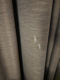 Dirty curtains with who knows what "white substance"