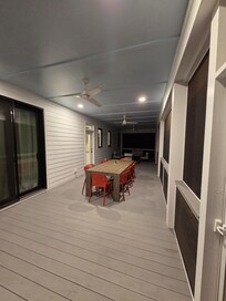 Back porch. We loved eating dinner and playing games at this table.