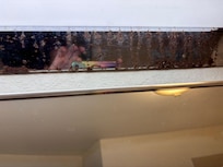Rusted top of the old mirror they never replace