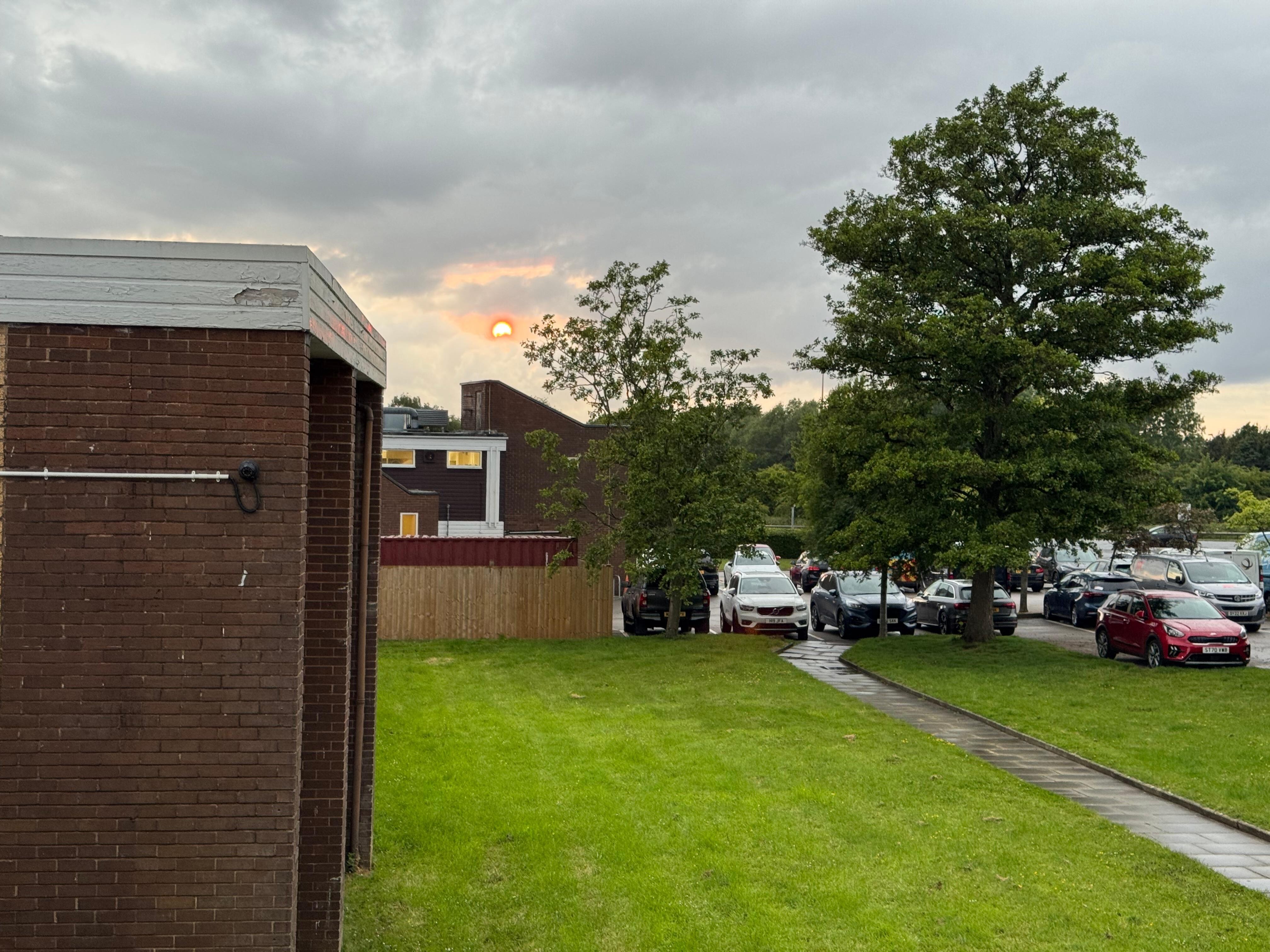 View from the executive room across the lawns to the side of the hotel to the car park