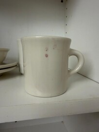 A glimpse of one of the dishes in the cupboard of the kitchen