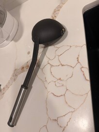 Dirty utensils throughout the kitchen