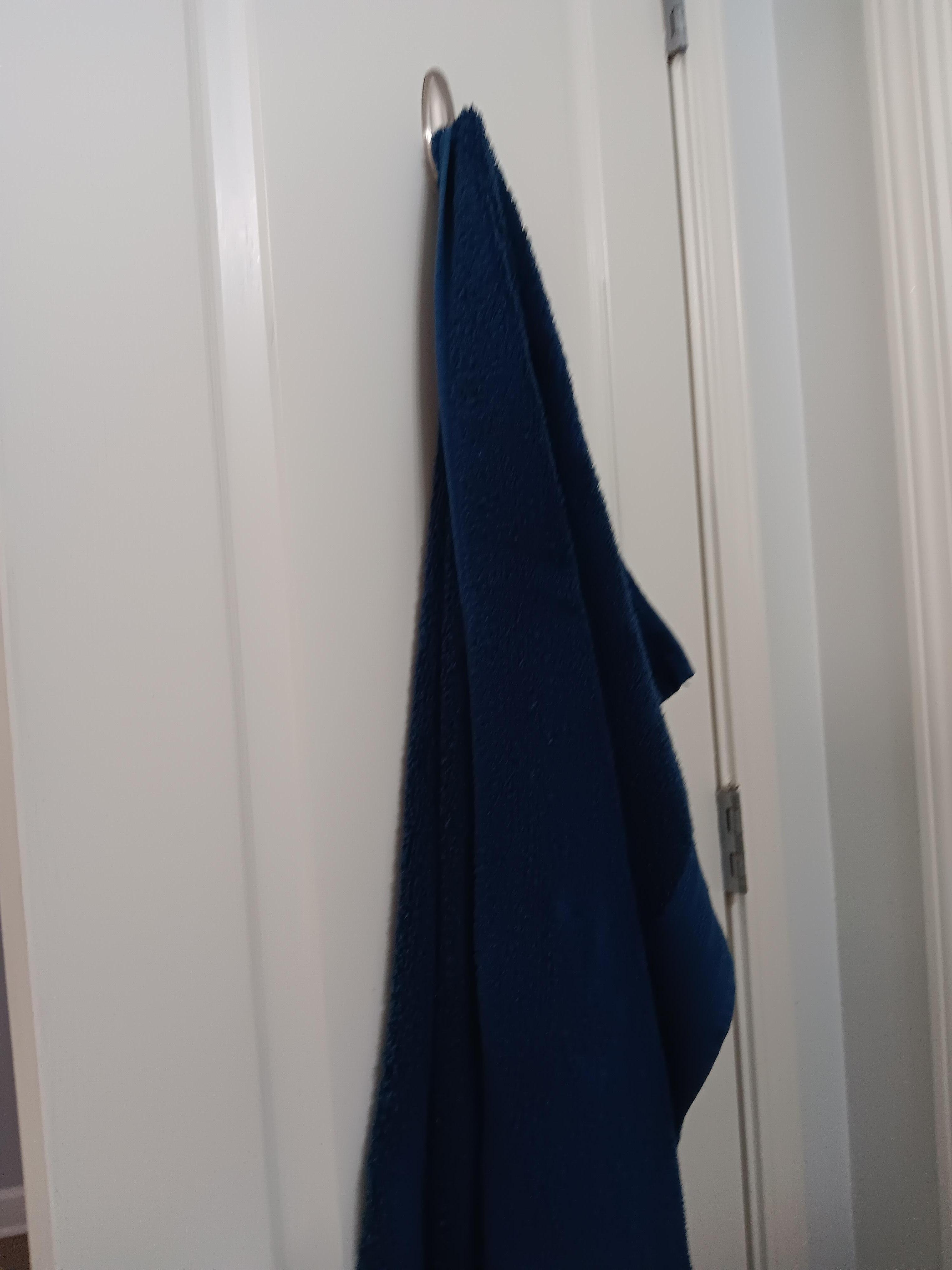 Dirty towels left hanging on the door
