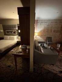 See between wall bedroom & sofa with tv.