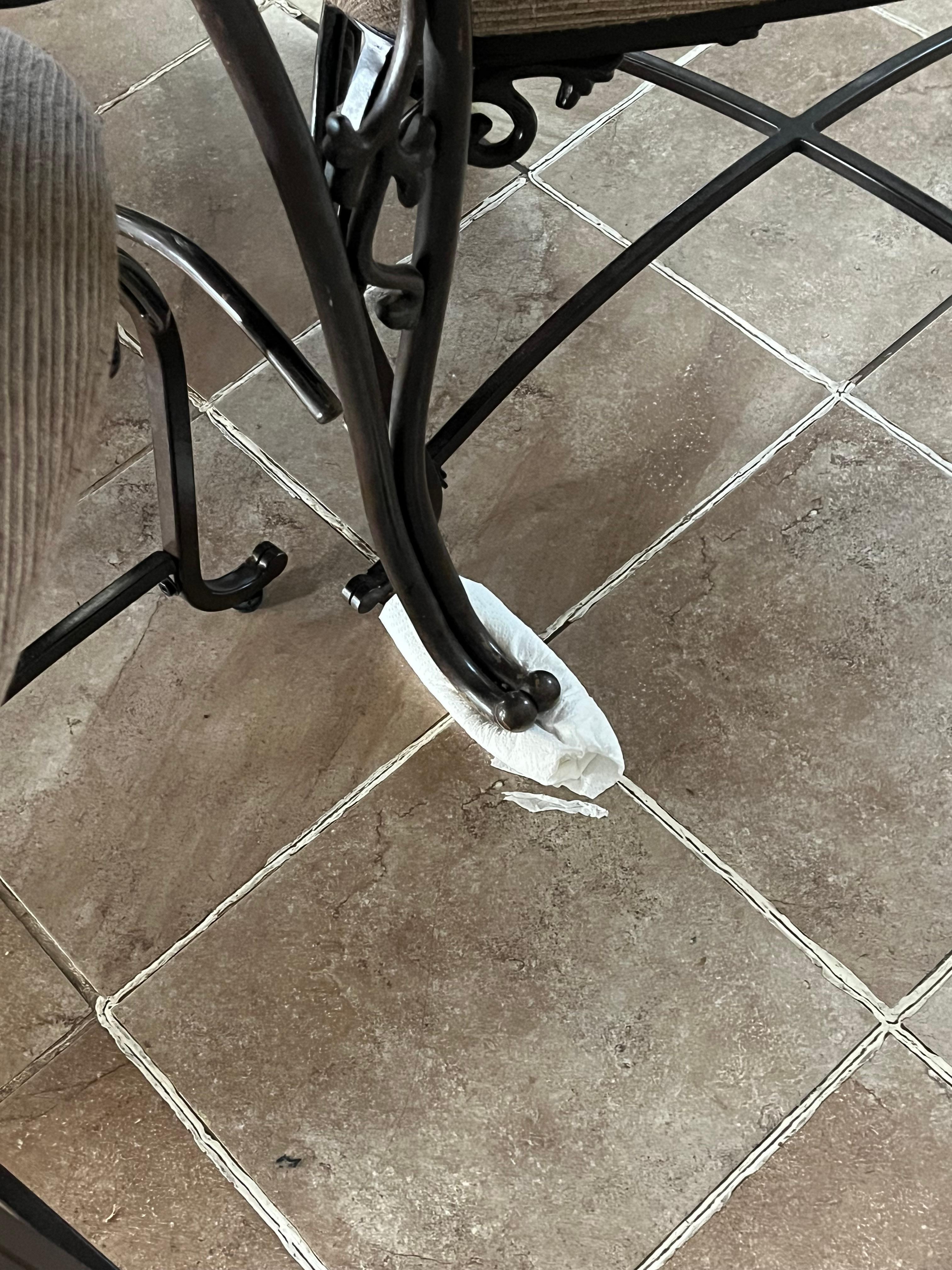 A table stabilized with a wadded up papertowel