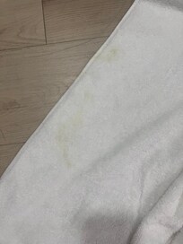Yellow stains on supposedly clean towel.