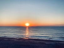 MORNING SUNRISE FROM THE LIVING ROOM BALCONY.