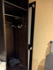 The wardrobe door was completely off and just resting against it when we arrived. We moved it to the side so it didn't fall on one of our children