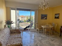The spacious living room/dining room with a lovely balcony.