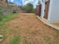 Side of villa - landscaped grounds