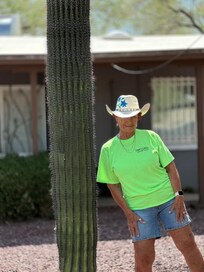 Taken in front of the house next to at large catus.