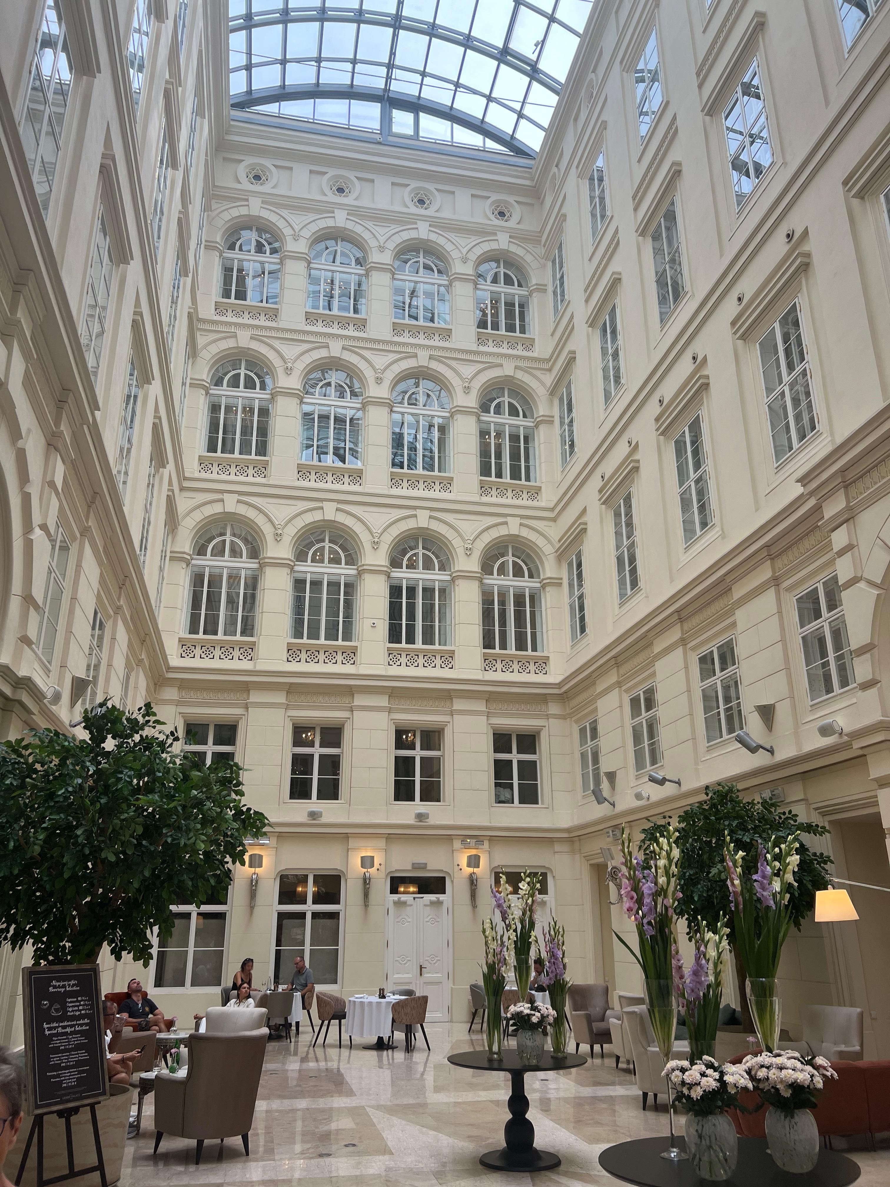 The atrium inside the hotel, often with a pianist on the grand piano