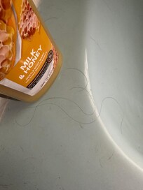 Hair on the tub.