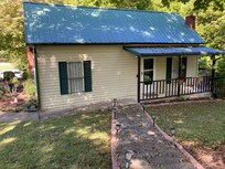 Just a lovely cottage and a fantastic back porch w a swing and dining table.
