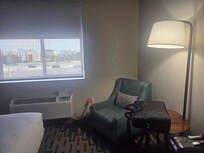 Small table area, 1 lounge chair.