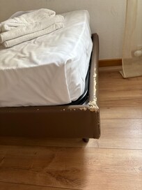 Scratched and torn bed frame