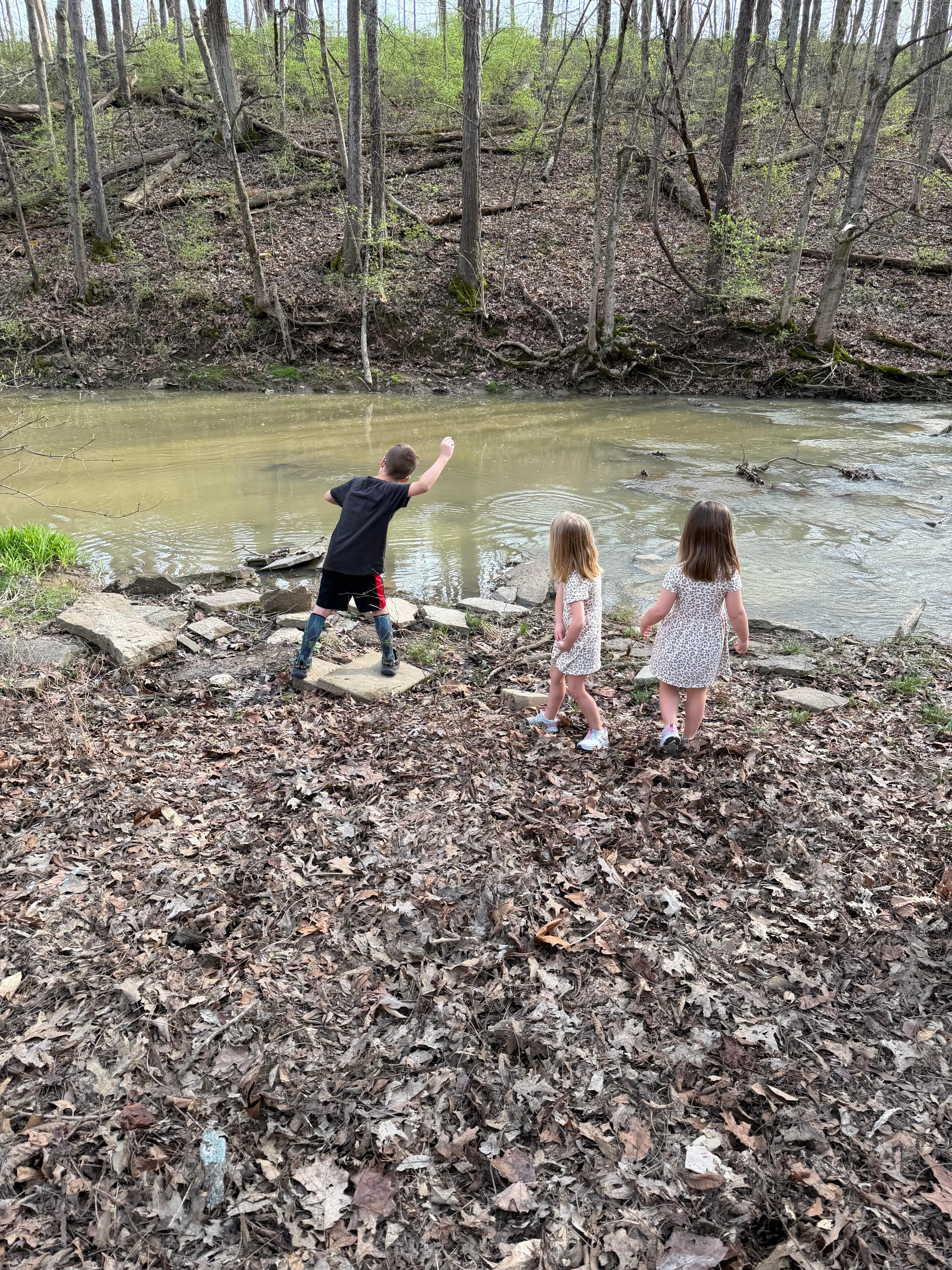 Kids playing at the creek.