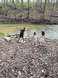 Kids playing at the creek.
