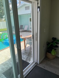 Screen at door is ripped.