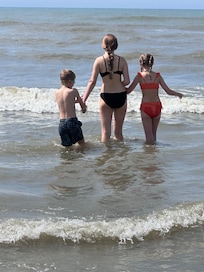 Grandson and 2 of his sisters enjoying the surf