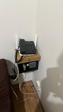 The brown box underneath the phone