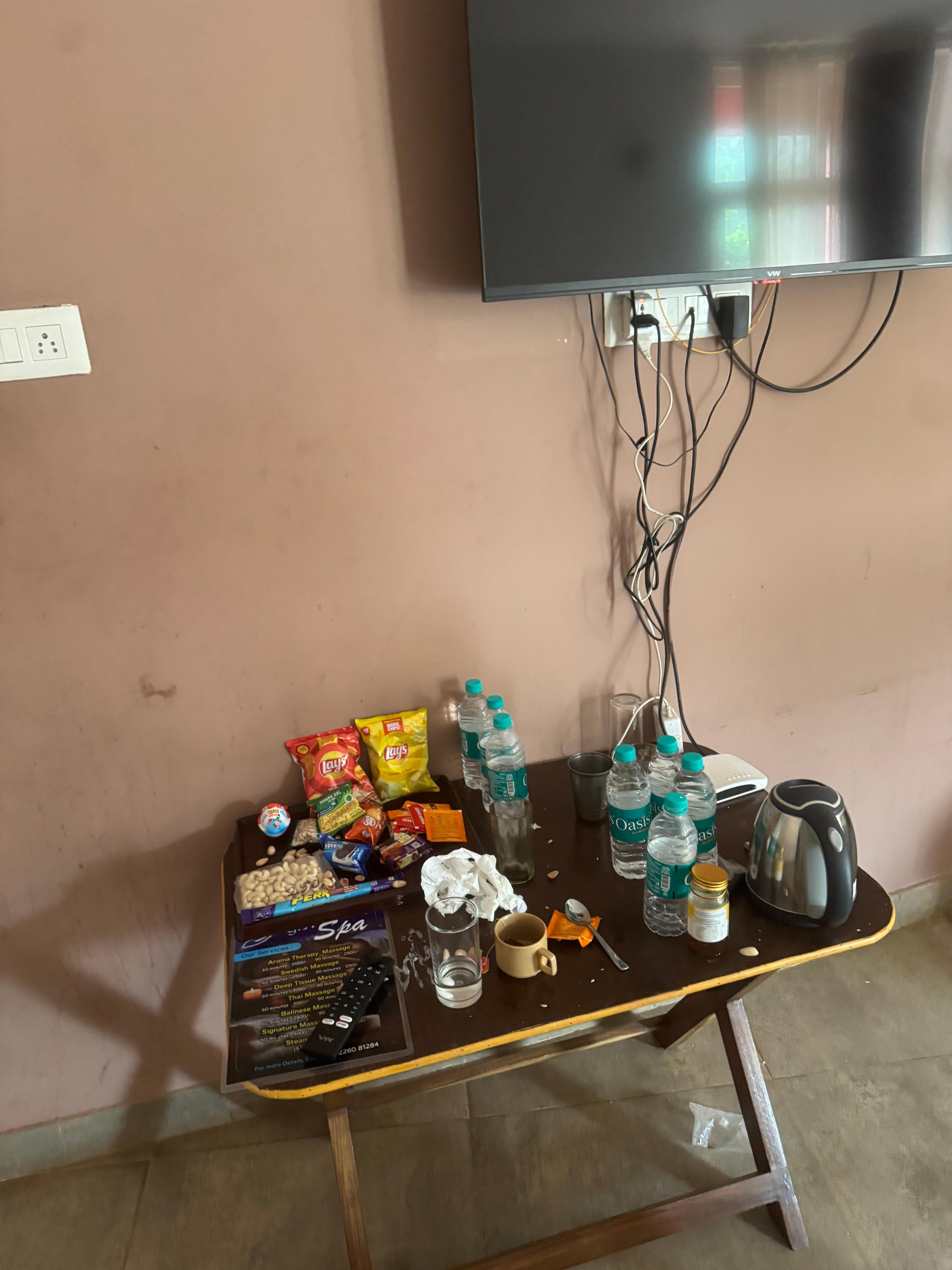 Picnic table and television in the room. 