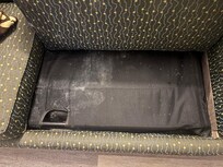 The sleeper sofa under the cushions