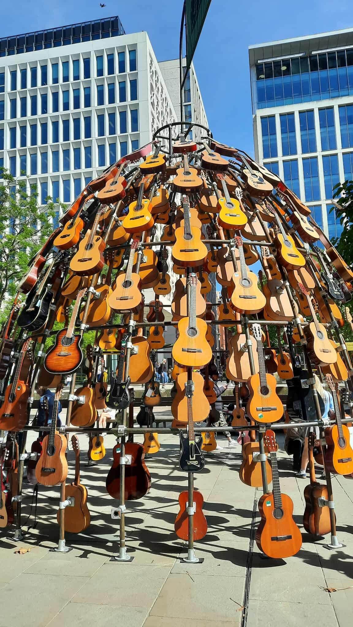 Sculpture of guitars outside of the Manchester Central Library.