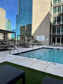 6th floor pool with city view surrounded on three sides by the hotel.