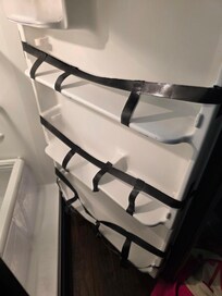 Broken shelves and drawers were all taped up