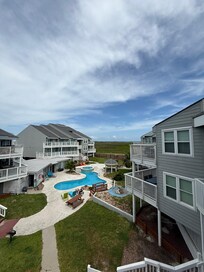 View from the condos balcony to the beach/pool