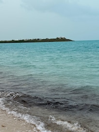 The view of the house from long bay beach.