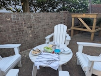 Patio with chairs and table off the kitchen
