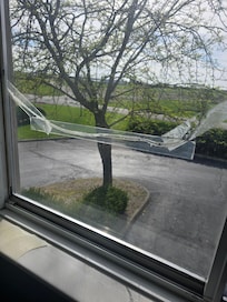 Broken and taped window eith mold