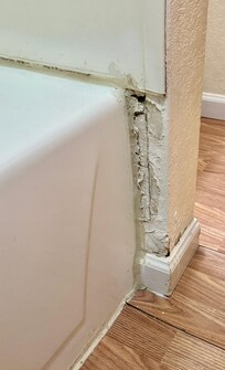 Wall adjacent to bathtub