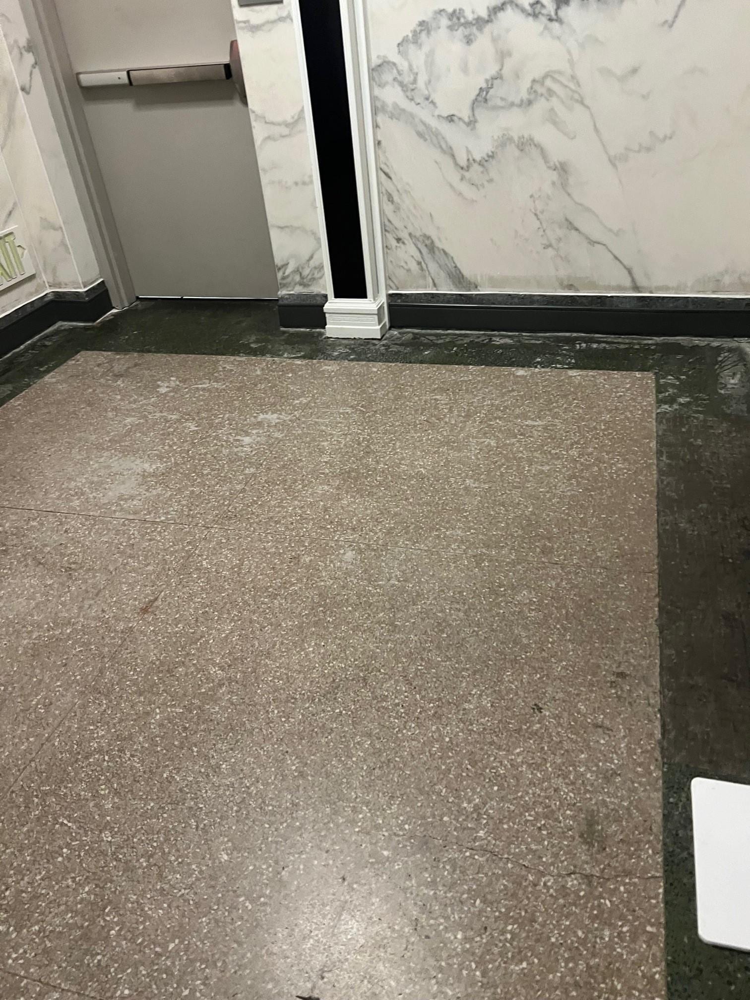 Area outside of elevator on floor with rooms