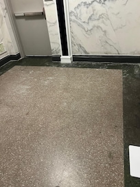 Area outside of elevator on floor with rooms