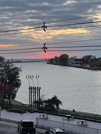 Views of Lake Michigan and the (cloudy) sunset from the balcony.