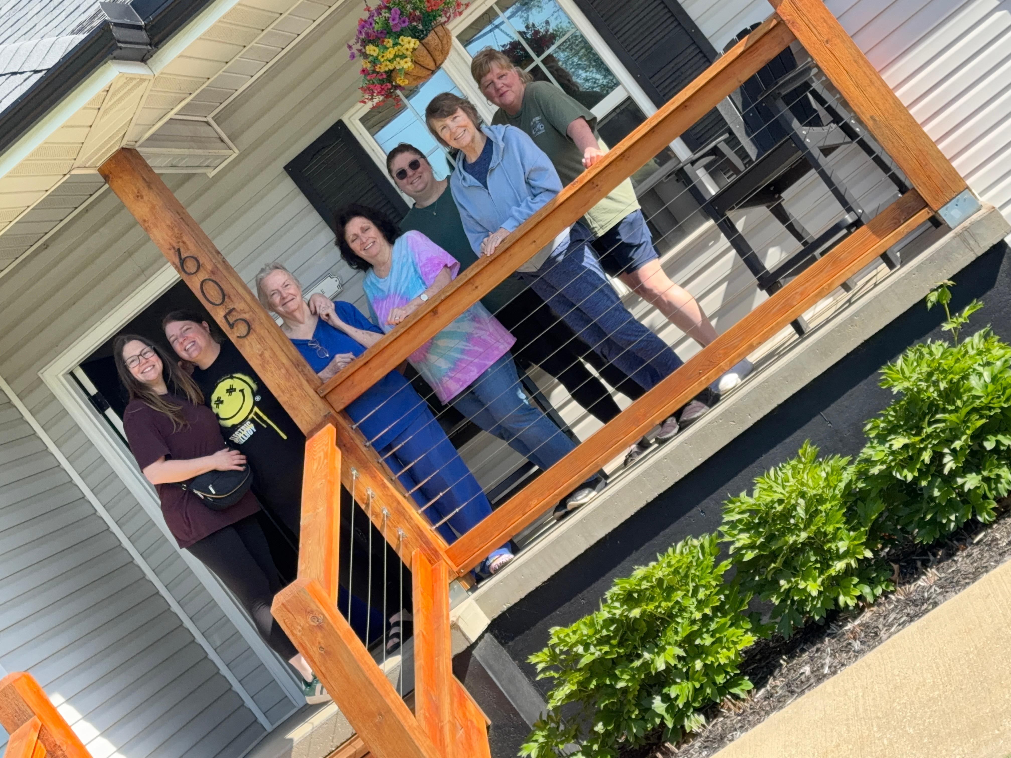 Cute front porch, and well maintained the landscaping