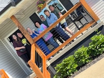Cute front porch, and well maintained the landscaping