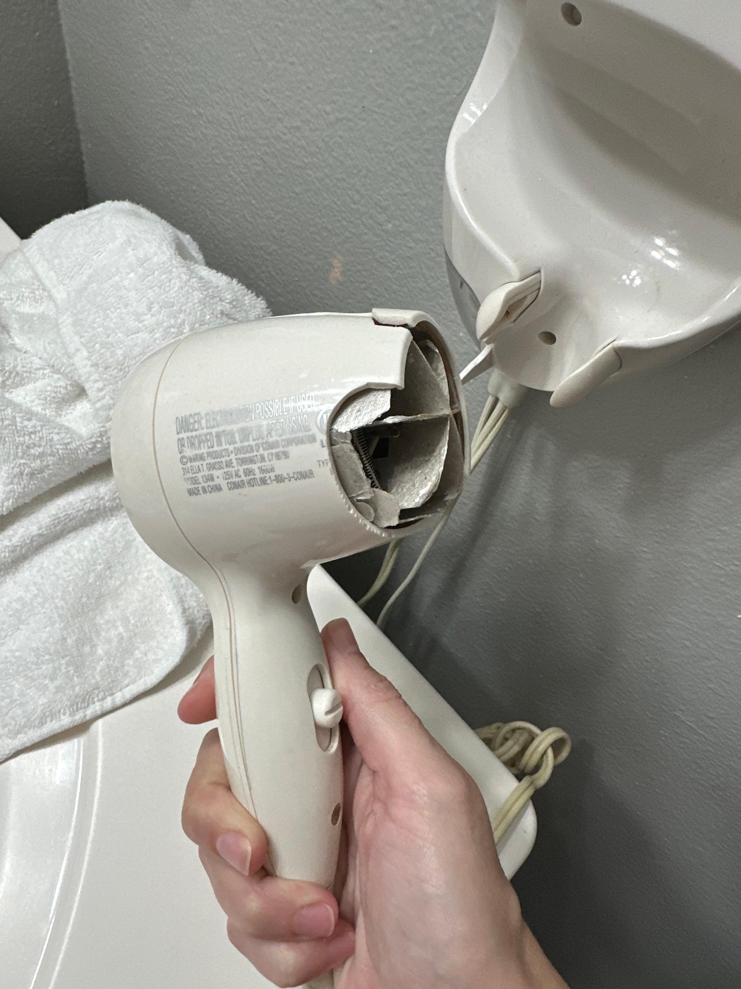 Broken hairdryer. Exposed elements 