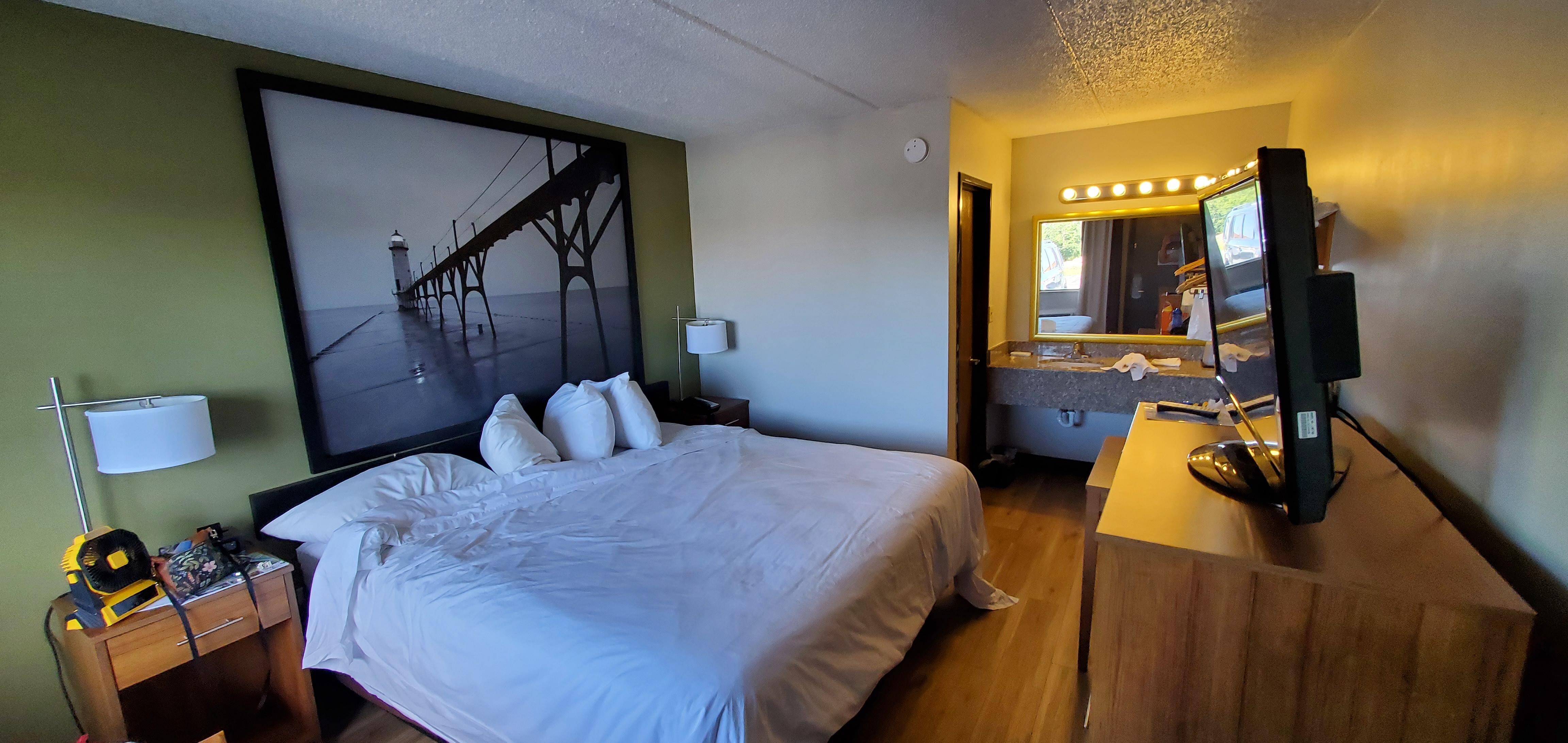 This was taken after we settled in a bit. Bed had a cover sheet that we took off. Bath area was clean when we came in. Not bad just a completely average but comfortable space for 2 people.