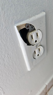 Example of damaged outlet next to where the child was to sleep