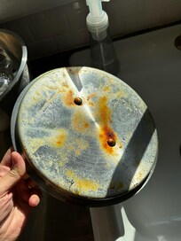 Pot lids and dishes put away slicked with grease, caked with old food