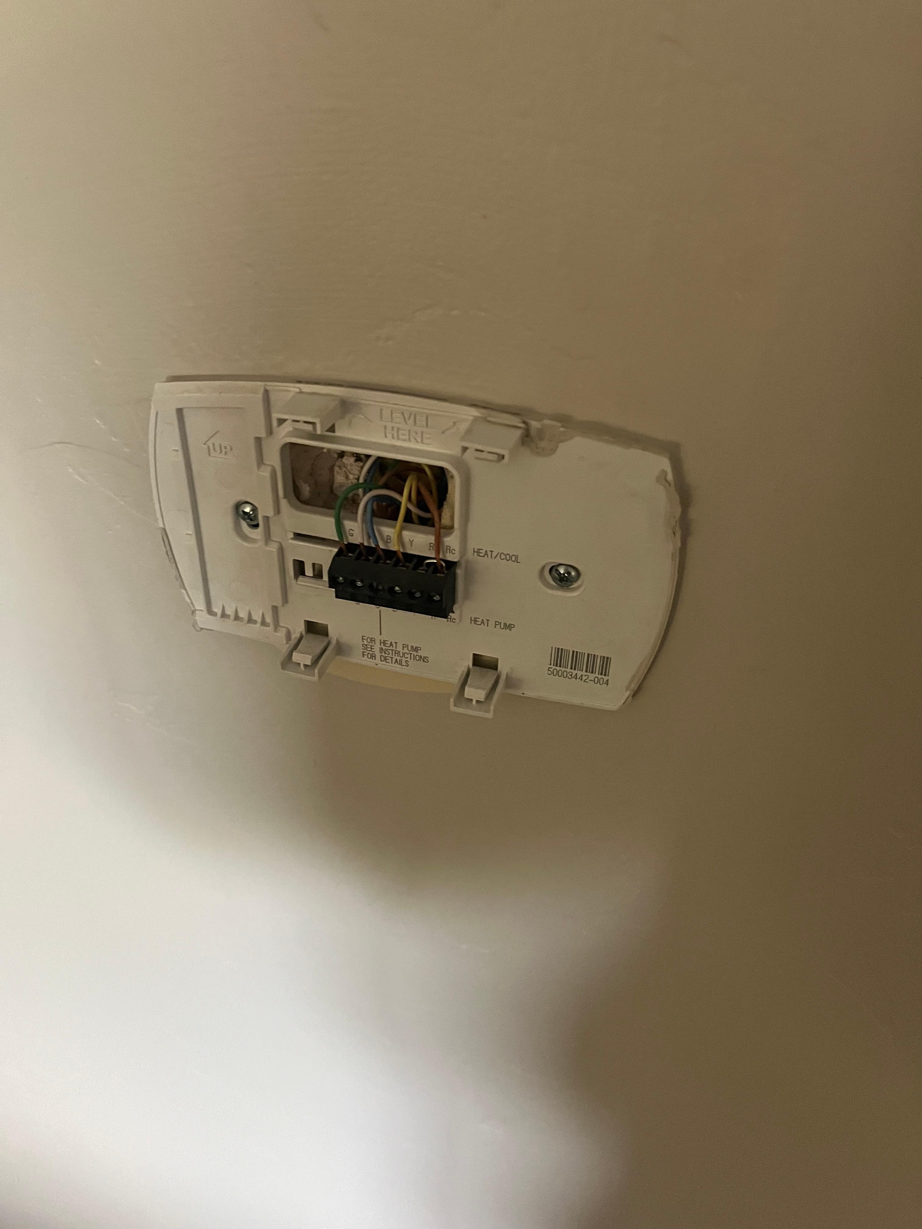 The rest of the thermostat was sitting on a table