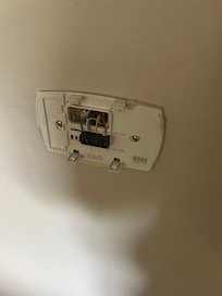 The rest of the thermostat was sitting on a table